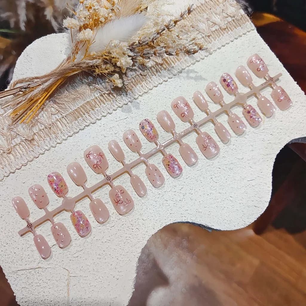 Růžové nalepovací nehty s motýlkem, mašlí a glitry